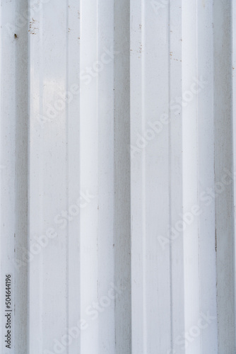 White aluminum structure texture. Different levels of elevation. White corrugated metal texture surface panorama or galvanized steel background