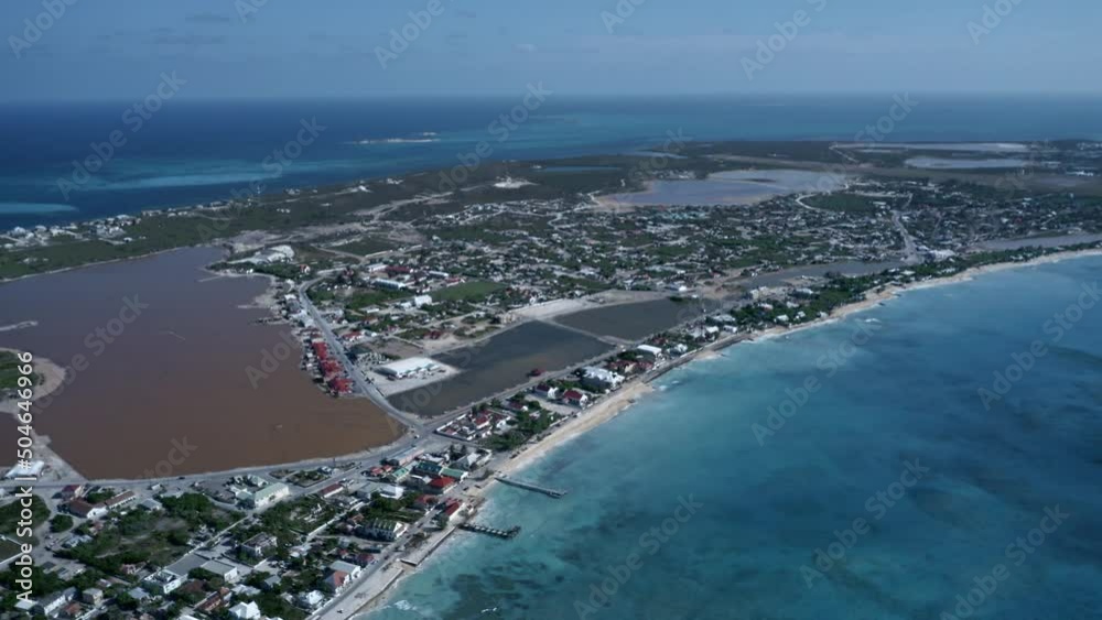 Aerial view of Cockburn Town with saline lake in the middle in the middle of the Grand Turk island, drone panoramic footage of Turks and Caicos
Aerial view of Cockburn Town with saline lake in the middle in the middle of the Grand Turk island, drone panoramic footage of Turks and Caicos