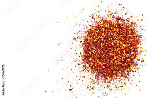 Pile of red pepper flakes on a white background