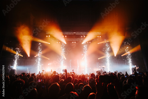 Fire sparks on a concert in front of  the crowd