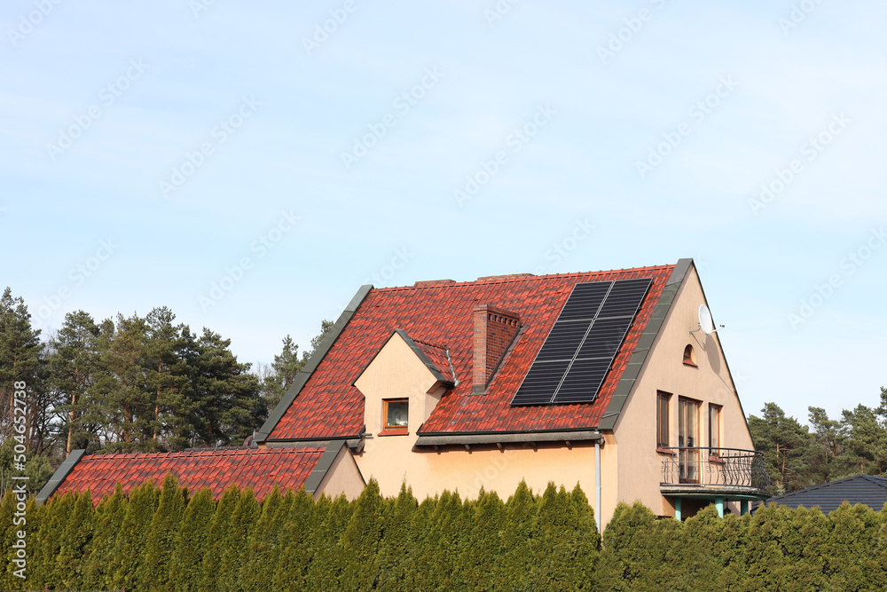 House with installed solar panels on roof. Alternative energy House with installed solar panels on roof. Alternative energy