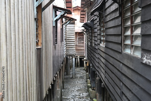 Georgetown, Penang Malaysia - May 13, 2022: The Clan Jetties of Georgetown Penang, Malaysia. Wooden villages built on stilts at the sea coast by the different clans of the Penang Chinese community. photo