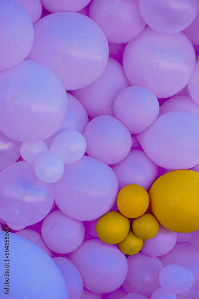 balls of blue or purple color, composition on the wall at a presentation or holiday 