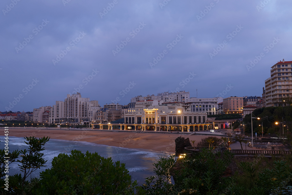 Biarritz city in the Bay of Biscay, France, panoramic view with Pyrenees mountains and Atlantic ocean at night.