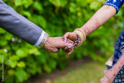 Indian couple's holding hands close up © Stella Kou