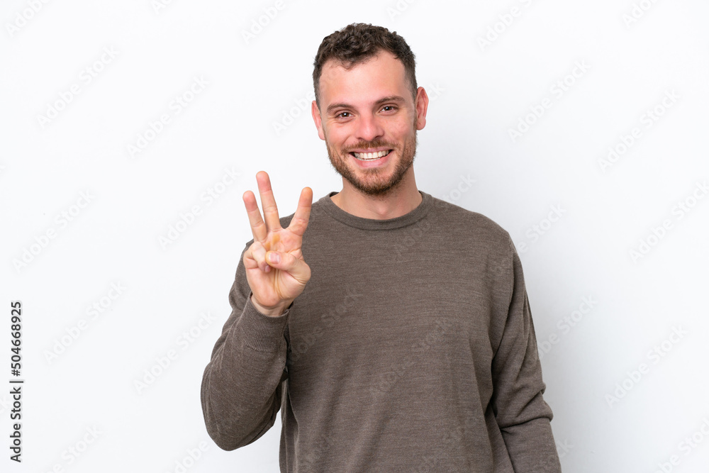 Young Brazilian man isolated on white background happy and counting three with fingers Young Brazilian man isolated on white background happy and counting three with fingers