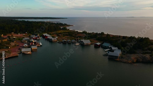 Aerial view of a village of boathouses in Karingsund, Ahvenanmaa, Finland - tracking, drone shot photo