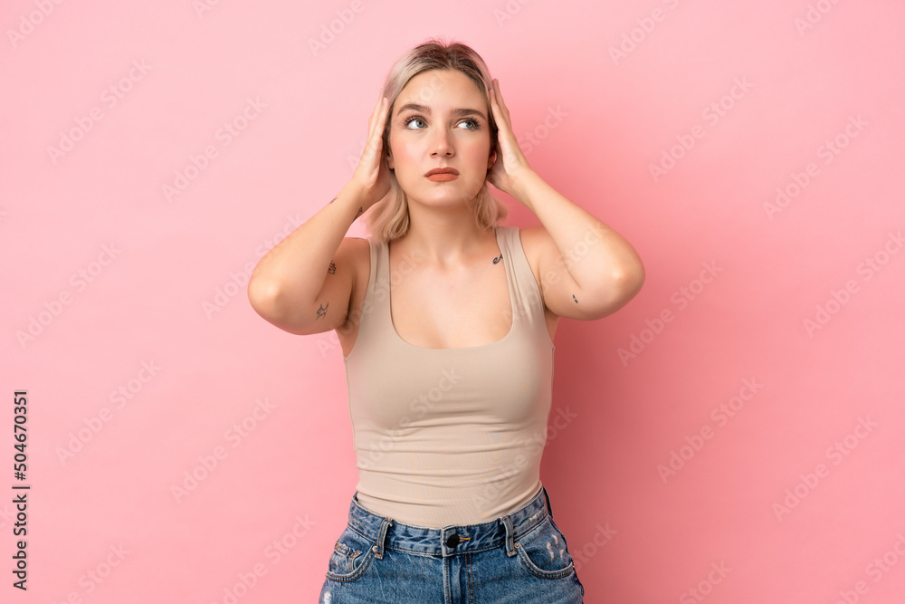 Young caucasian woman isolated on pink background frustrated and covering ears Young caucasian woman isolated on pink background frustrated and covering ears