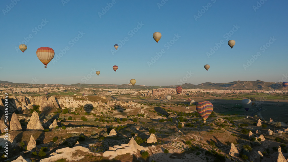 Hot-air ballons flying above Cappadocia at dawn, Turkey