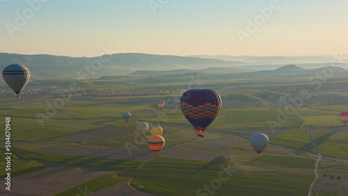 Beautiful hot-air ballons in Cappadocia at sunrise, Turkey photo