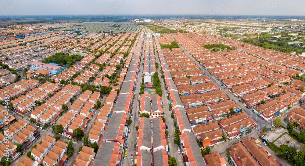 Foto Stock Aerial drone shot of suburb area surrounded by high density  village in overpopulation city for housing and real estate property concept  | Adobe Stock