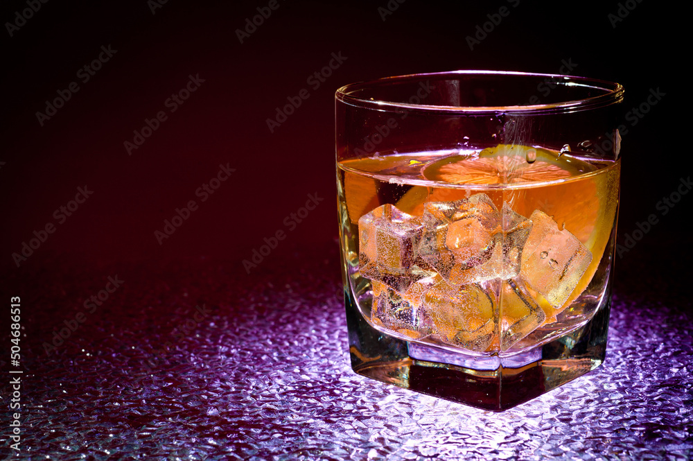 Glass transparent glass with drink and ice cubes for cooling and lemon. Glass transparent glass with drink and ice cubes for cooling and lemon.