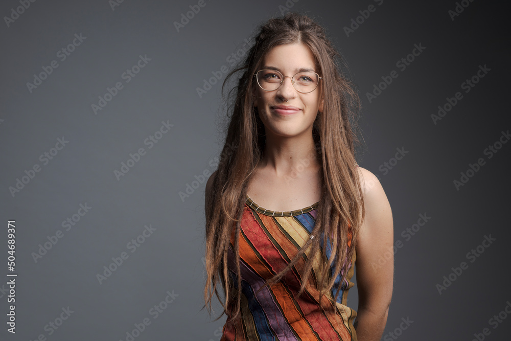 Portrait of young woman with piercing, dreadlocks and long hair Portrait of young woman with piercing, dreadlocks and long hair