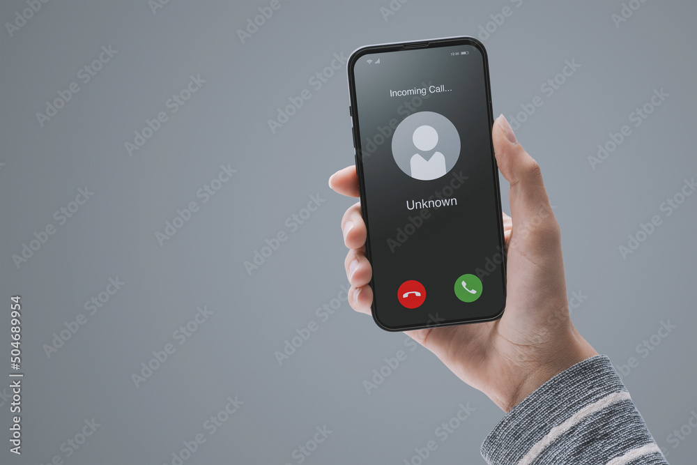 Woman receiving a call from an unknown user Woman receiving a call from an unknown user