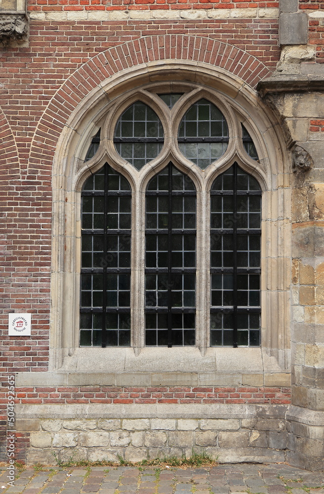 Obraz premium Amsterdam Oude Kerk Church Exterior Detail with Arched Window, Netherlands