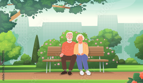 Cute elderly couple is sitting on a bench in a city park. Seniors rest outdoors