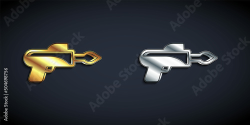 Gold and silver Fishing harpoon icon isolated on black background. Fishery manufacturers for catching fish under water. Diving underwater equipment. Long shadow style. Vector