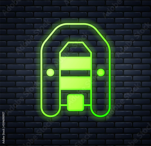 Glowing neon Inflatable boat with outboard motor icon isolated on brick wall background. Vector