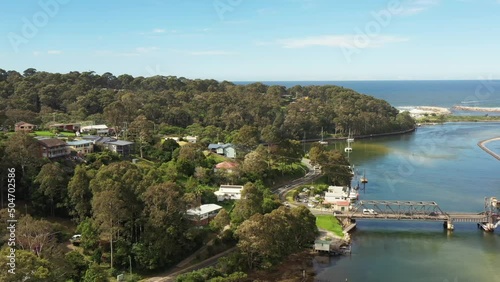 Wide aerial hovering over oyster fish farms in Wagonga inlet Narooma as 4k.
 photo