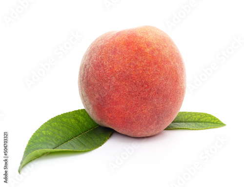 One ripe peach and leaves.