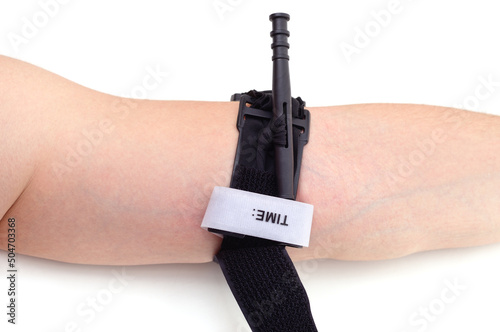 Hemostatic tourniquet imposed on hand.