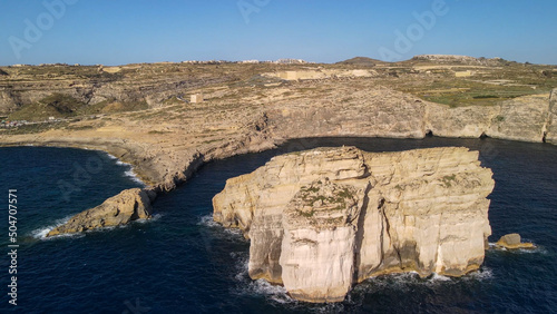 Aerial view of Fungus Rock in Dwejra Bay, Gozo