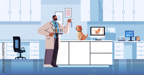 scientist or veterinary worker doing experiments in lab with experimental dog biological genetic engineering research
