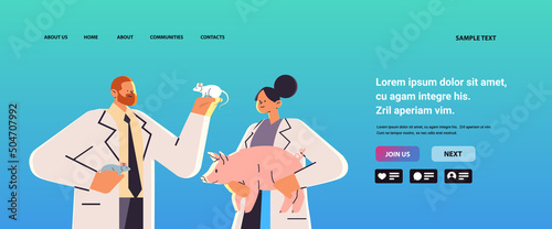 scientists or veterinary workers doing experiments in lab with experimental animals biological genetic engineering research