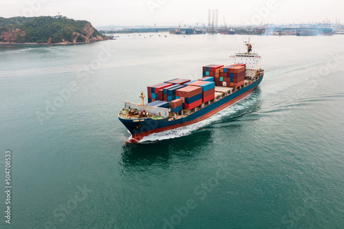 Container ship transporting cargo logistic import and export goods internationally around the world, including Asia Pacific and Europe, Aerial view
