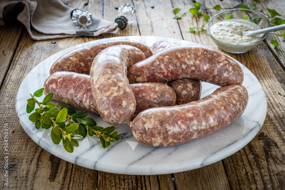 Raw white sausages on wooden table
Raw white sausages on wooden table