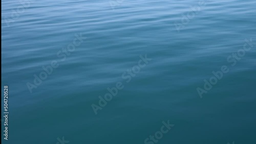 Surface water texture for background. Horizontal footage.   Calm and relaxing background with clear sea ripples.
