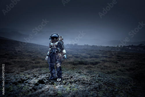 Astronaut walking on an unexplored planet © Sergey Nivens