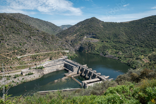 Entre montes e montanhas o rio Douro e ao fundo a barragem hidroelétrica da Valeira em Trás os Montes, Portugal photo