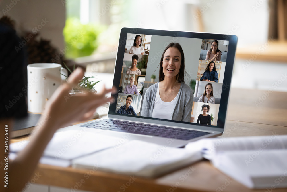 Employee talking to coworkers on Internet conference, using laptop. Cropped shot, close up of hands at computer screen. Diverse team leader, multiethnic group video call head shots on display Employee talking to coworkers on Internet conference, using laptop. Cropped shot, close up of hands at computer screen. Diverse team leader, multiethnic group video call head shots on display