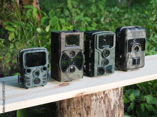 Comparison of different trail camera. Photo and video trap. Animal and surroundings monitoring device with motion sensor and night vision photo