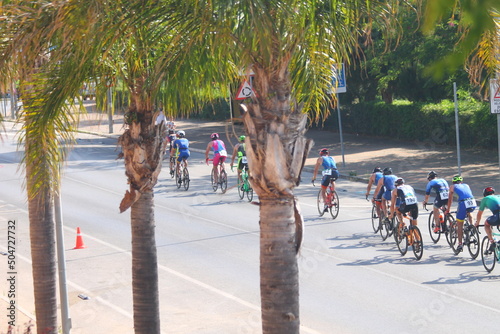 People cycling in triathlon race photo