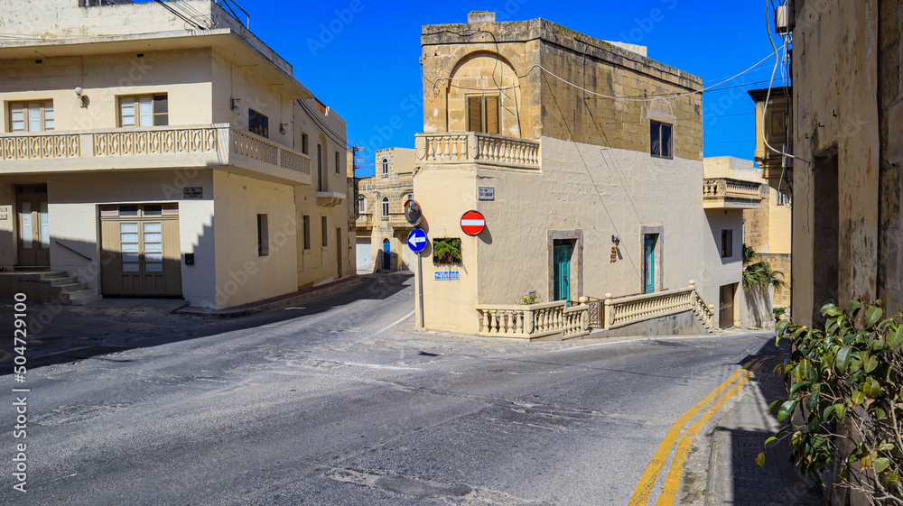 A fork in the road in an old Gozitan village.