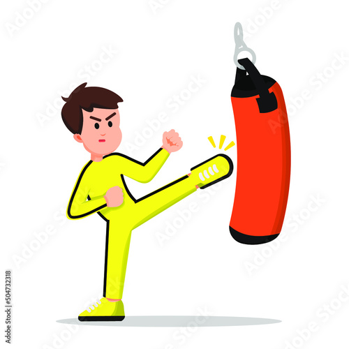 boy practicing martial arts with a bag as the object of his training