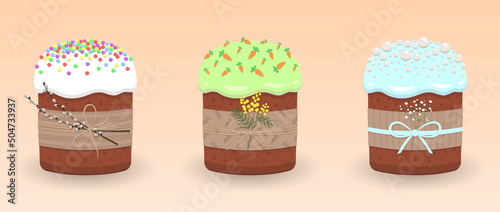 Easter cakes, kulich, white icing and colored sprinkles and easter pussy willow twigs, green icing and sprinkled with carrots and a sprig of mimosa, blue icing and pearls and a sprig of gypsophila
