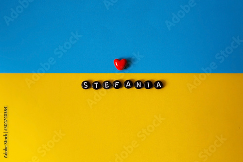 Stefania words. Ukraine is the winner. Song Stefania. I love Stefania. song contest. Isolated on the background of the Ukrainian flag photo