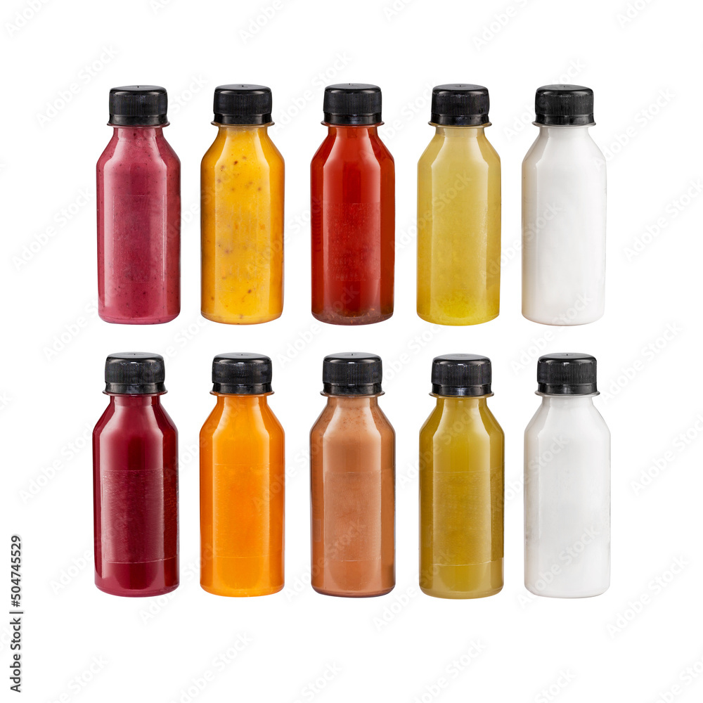 colorful smoothies in bottles with fresh tropical fruit and superfoods isolated on white