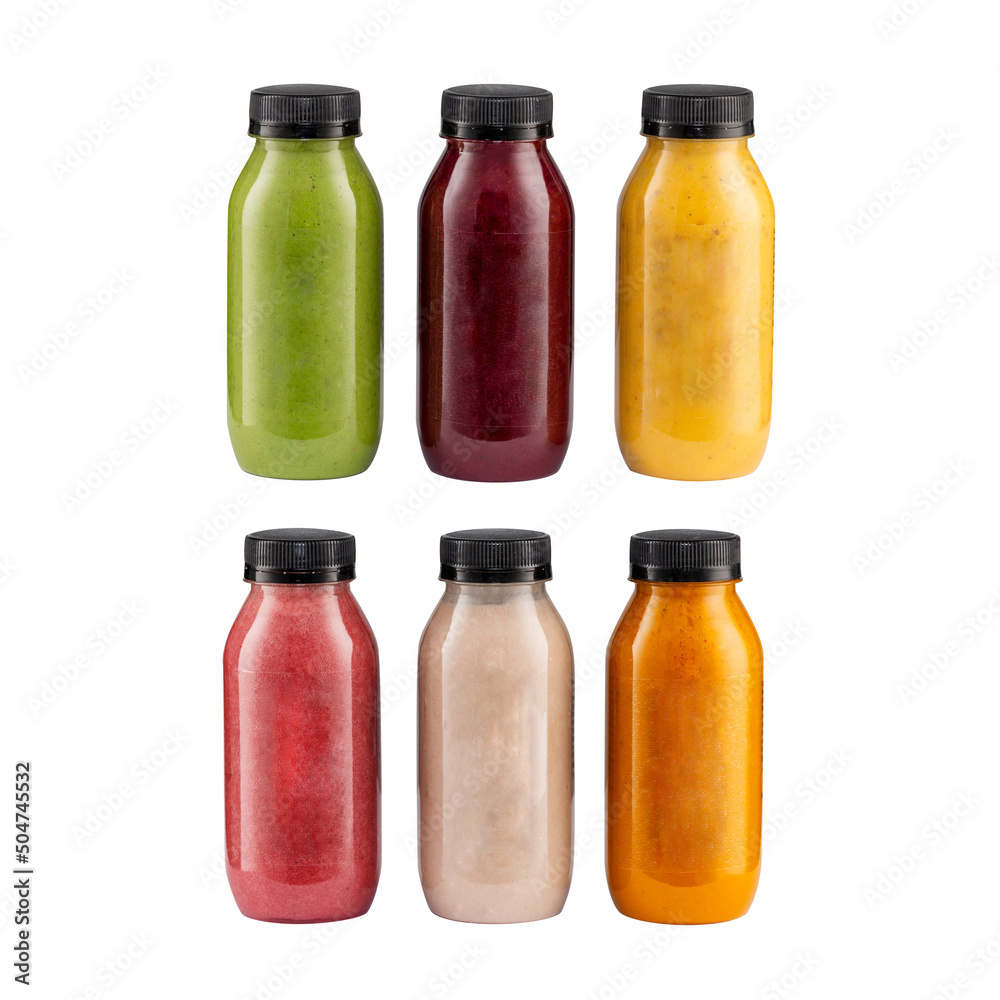 colorful smoothies in bottles with fresh tropical fruit , berries and superfoods isolated on white