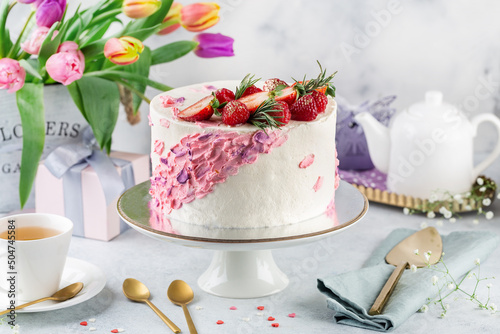 Obraz na płótnie festive white and pink cake on a light background. Sweets concept w salonie