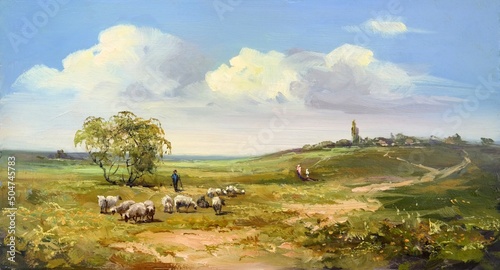 a flock of sheep and a shepherd in the summer meadows near the village