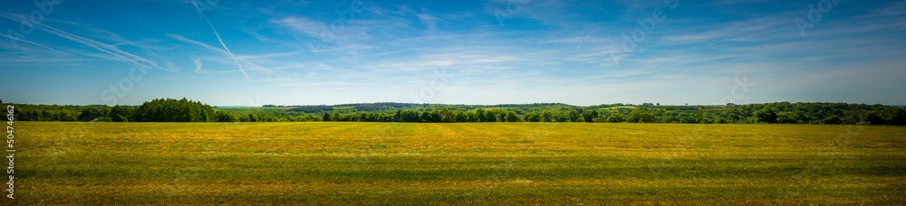 Panorama shot of an agricultural field in the sloping hills of the Condroz in Wallonia, Belgium.