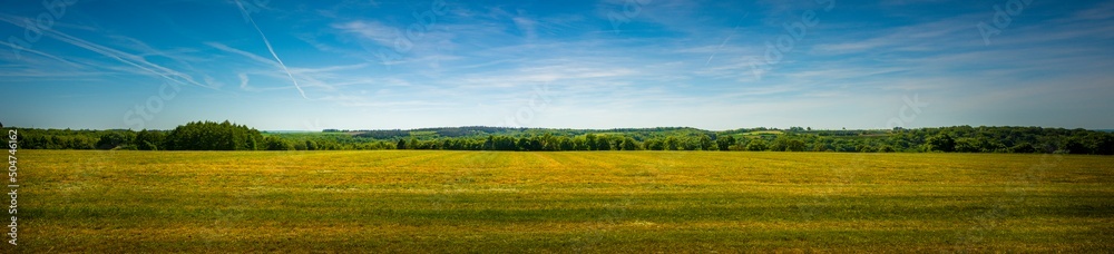 Panorama shot of an agricultural field in the sloping hills of the Condroz in Wallonia, Belgium. Panorama shot of an agricultural field in the sloping hills of the Condroz in Wallonia, Belgium.