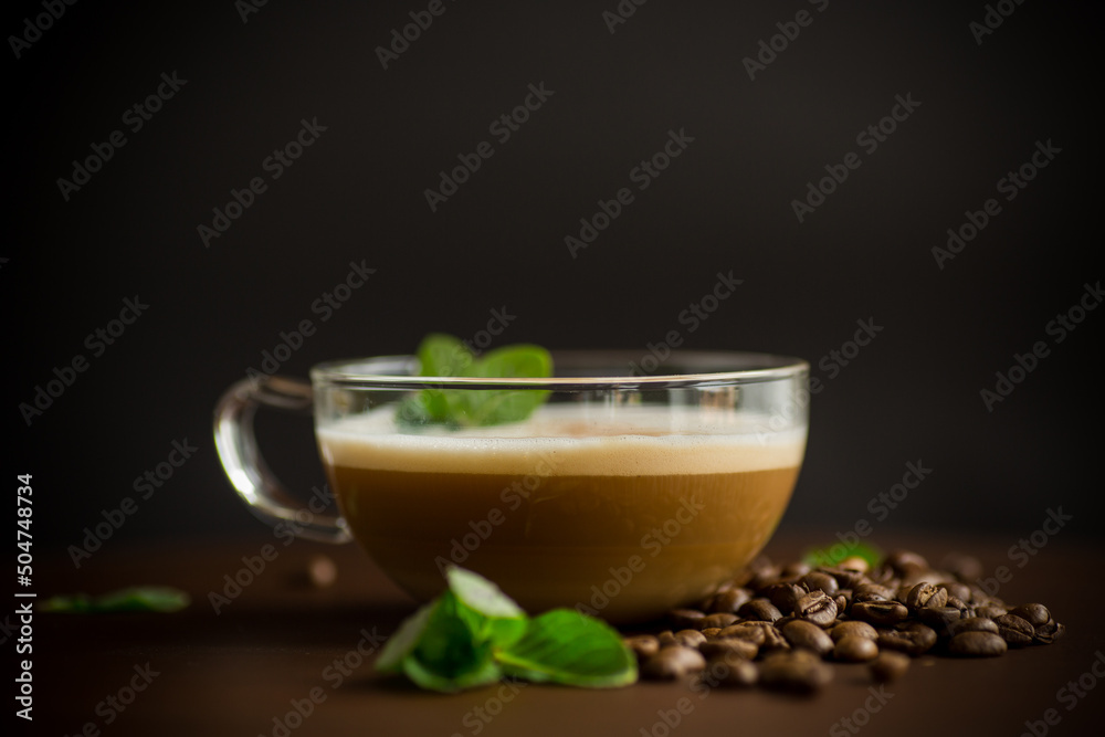 Cup of coffee latte with heart shape and coffee beans Cup of coffee latte with heart shape and coffee beans