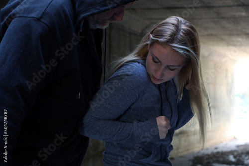 Young female defending herself from an attack	