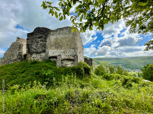 Low angle view of the ruins of the Hugstein castle in Buhl, a beautiful summer day with some clouds photo