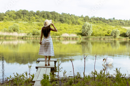 Young woman standing on the...
